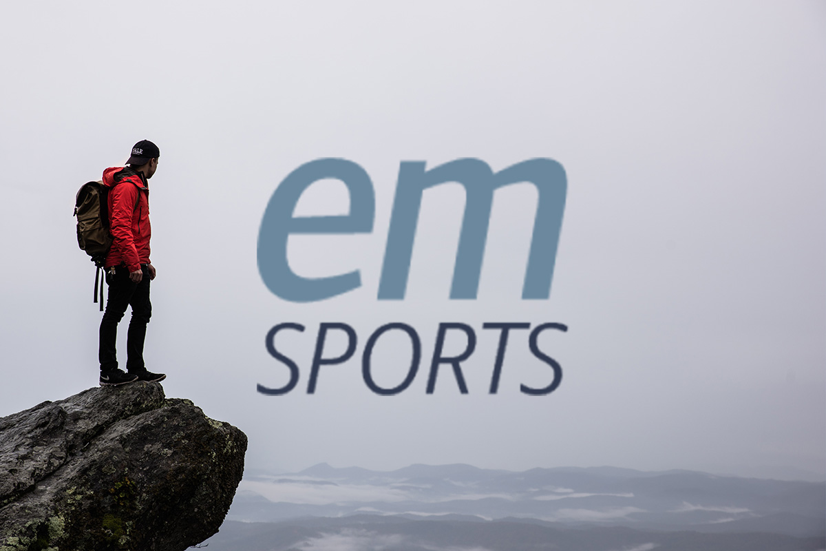 Man Standing On Cliff Sports Logo